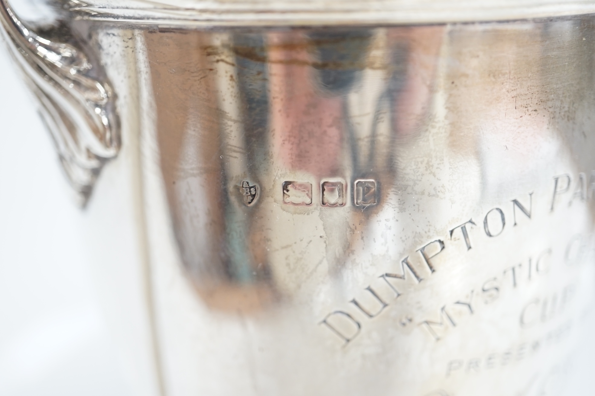 A George V silver two handled presentation trophy cup and cover, 'Dumpton Park Stadium Cup', Edward Barnard & Sons Ltd, London, 1920, 27.8cm, 15.1oz. Condition - poor to fair